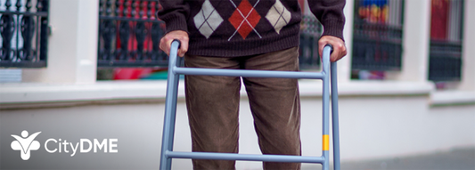Images shows older man using a walker in outdoor urban setting