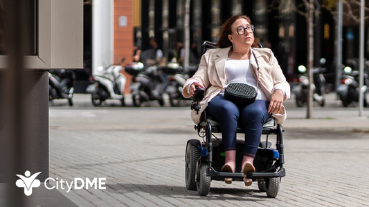 Image shows woman with scooter navigating outdoor pavement
